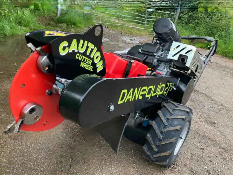 Red and black stump grinder
